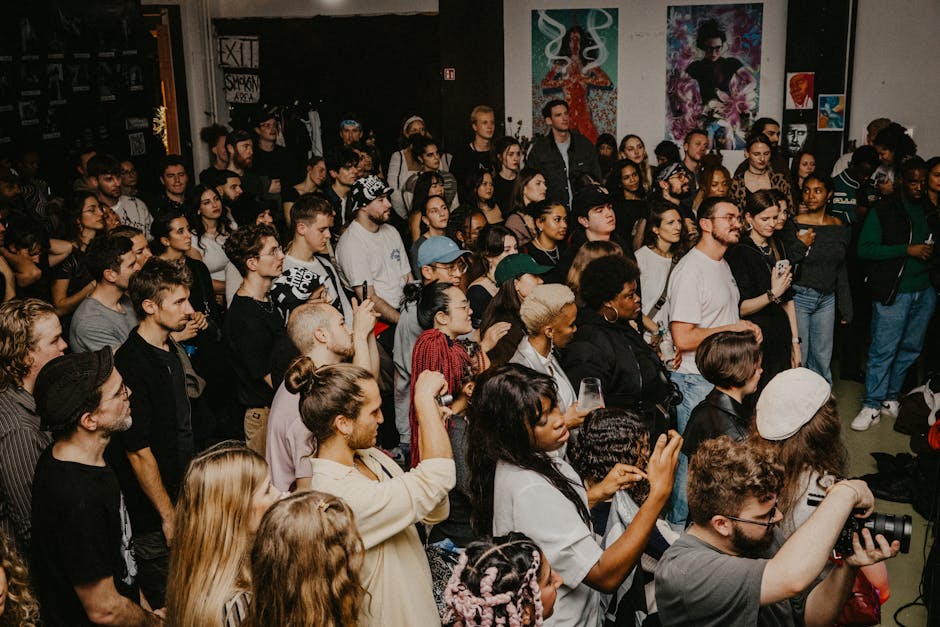 A lively crowd attending an art event in Berlin, showcasing diverse styles and interactions.